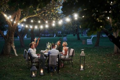 active-conversation-evening-time-friends-have-dinner-gorgeous-outdoor-place